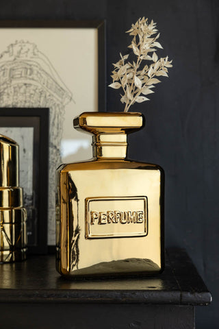 Lifestyle image of the Gold Perfume Bottle Vase