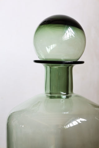 Close-up image of the Green Glass Apothecary Bottle