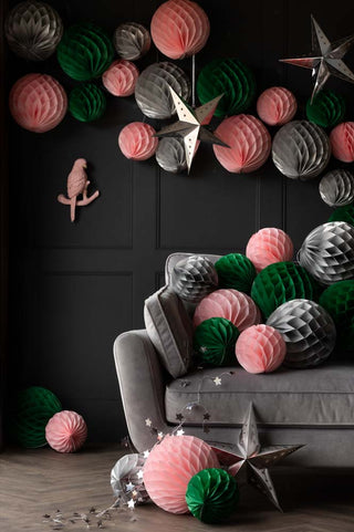 Silver honeycomb ball decorations styled with pink and green honeycomb balls.