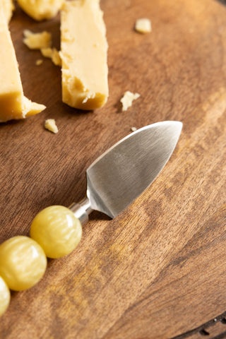 Close up image of a cheese knife from the HKLIVING Yellow Bobble Cheese Knives Set. 