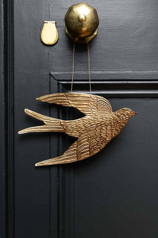 Lifestyle image of the Gold Swallow Hanging Ornament