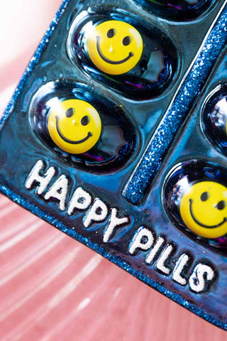 Close-up image of the Happy Pill Glass Christmas Tree Decoration
