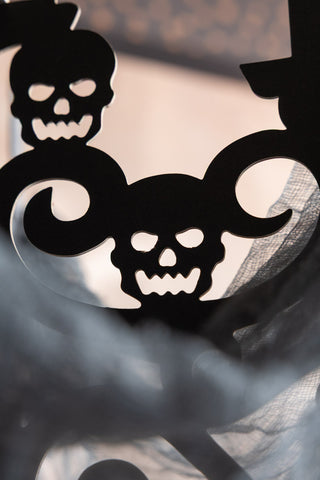 The skull detail on the Haunted House Paper Chandelier Decoration. 