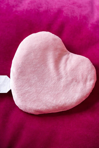 Image of the back of the Heart Shape 'Fuck Off' Microwaveable Wheat Bag