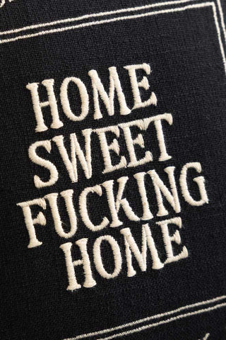 Close-up of the Home Sweet Fucking Home Embroidered Cushion.