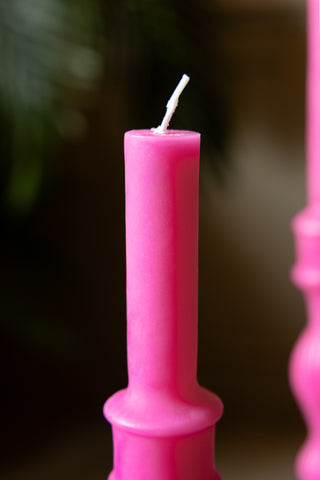 Close up image of the top of the candle with the wick left unlit. 