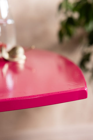 The edge of the Hot Pink Heart Metal Side Table. 