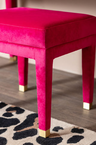 A close up image of the Hot Pink Velvet Stool that comes with the dressing table. 