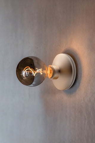 The Humble - Wall Light Cable-Free Mood Lighting in Gold & Smoked Glass Shade displayed on a neutral wall.