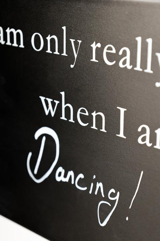 Close-up image of the I Am Only Really Happy When I Am... Blackboard