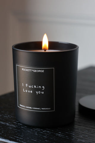 Lifestyle image of the Rockett St George I Fucking Love You Leather & Tobacco Candle