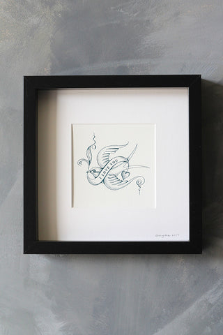 The I Love You Bird Tattoo Art Work By Brigitte Herrod displayed on a painted wall.