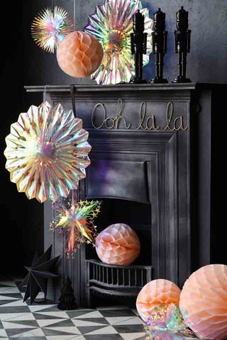 Image of the Iridescent Fan Christmas Decoration on a fireplace setting