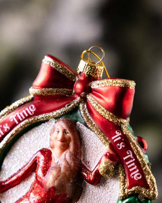 A close up of a christmas tree decoration with the words 'it's time'.