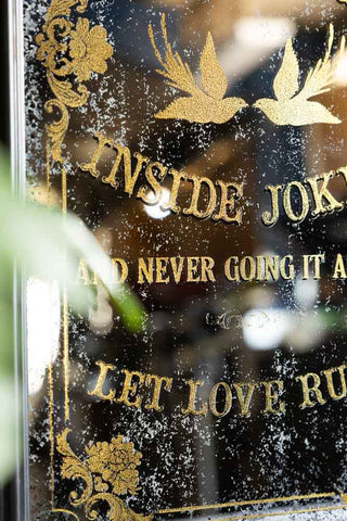 The beautiful antique style finish on the gold text and decorative pattern of the Kindred Spirits Decorative Mirror.  