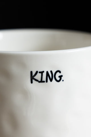 Image of the text on the King Mug