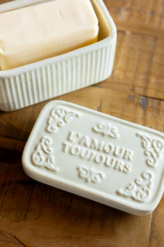 The L'Amour Toujours Butter Dish shown with the lid off and a block of butter inside. 