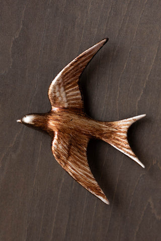 Close-up image of the Large Antiqued Copper Swallow Wall Decoration