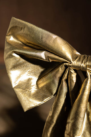 Close-up of the Large Gold Bow Christmas Decoration.