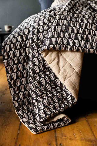 Close-up image of the Black & Natural Leaf Reversible Cotton Throw - 2 Sizes Available