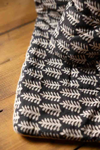 Detail image of the Black & Natural Leaf Reversible Cotton Throw - 2 Sizes Available