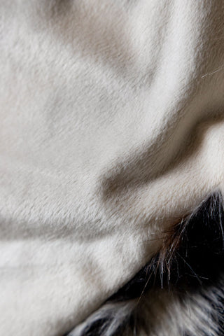 The soft and cosy underneath fabric of the Leopard Faux Fur Throw. 