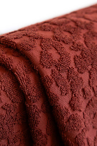 Close up detail of the Leopard Jacquard Towels in Burnt Brick.