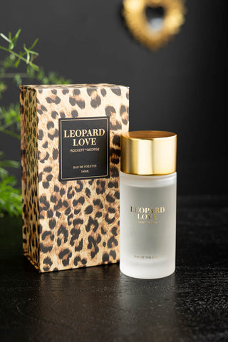 The Leopard Love Eau de Toilette - 100ml and box, styled on a dark surface.
