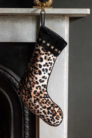 Lifestyle image of the Leopard Love Embroidered Star Christmas Stocking