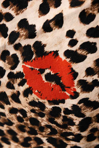 Close-up of the lips motif on the Leopard Love Print Tea Towel.