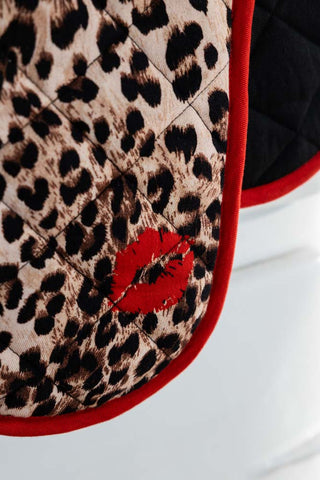 Detail shot of the design on the Leopard Love Print & Red Detailing Oven Gloves.