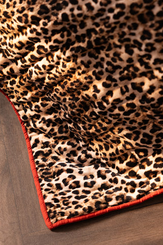 Detail image of the Leopard Love Print with Red Reversible Quilt