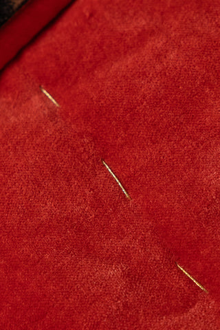 Image of the finish on the Leopard Love Print with Red Reversible Quilt