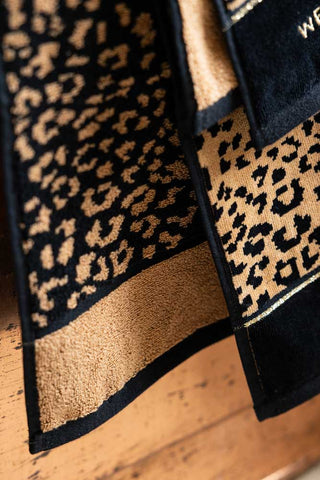 An image showing the front and reverse pattern on the Wet & Wild Leopard Print Bath Towel