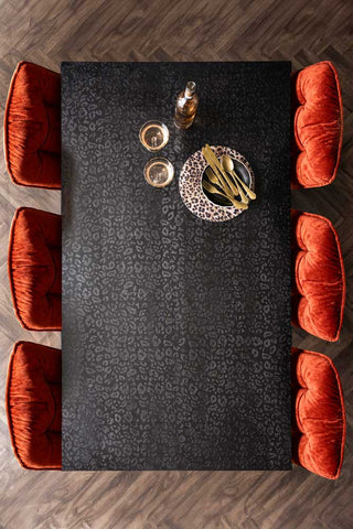 Lifestyle image of the Leopard Print Black Wood 6 Seater Dining Table