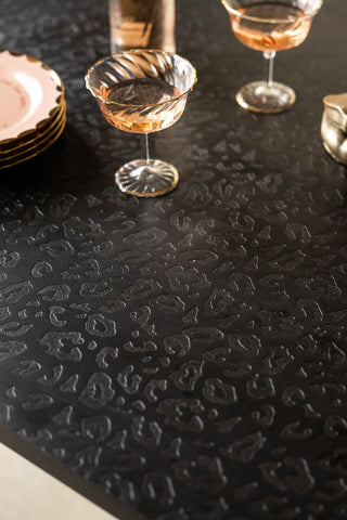 Close-up image of the Leopard Print Black Wood 6 Seater Dining Table