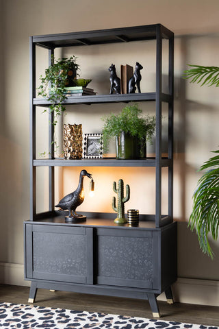 Lifestyle image of the Leopard Print Black Wood Shelving Unit
