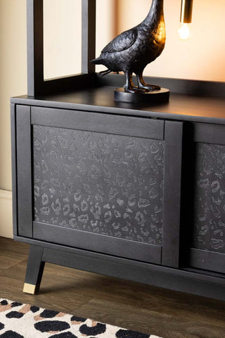 Close-up image of the Leopard Print Black Wood Shelving Unit