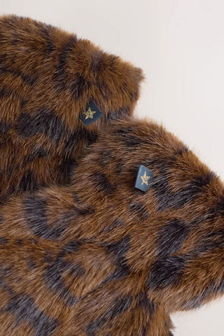Close-up of the Leopard Print Faux Fur Handwarmers on a white background.