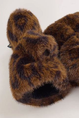 Close-up of the end of the Leopard Print Faux Fur Handwarmers on a white background.