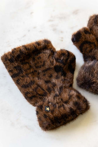 The Leopard Print Faux Fur Handwarmers displayed laying on a neutral surface.