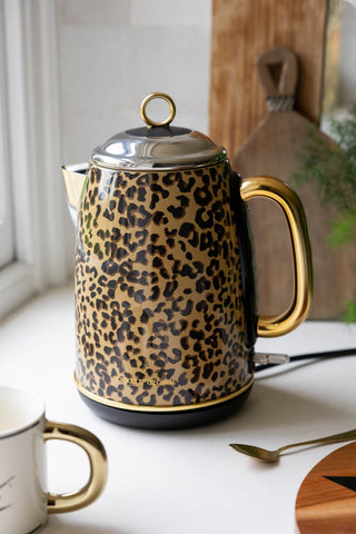 Image of the Fabulous Leopard Print Kettle in a kitchen with a mug next to it. 