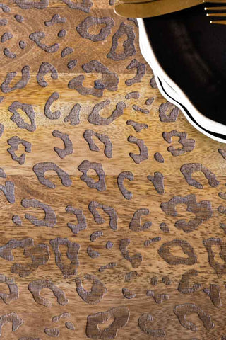 Close-up image of the Leopard Print Natural Wood 6 Seater Dining Table