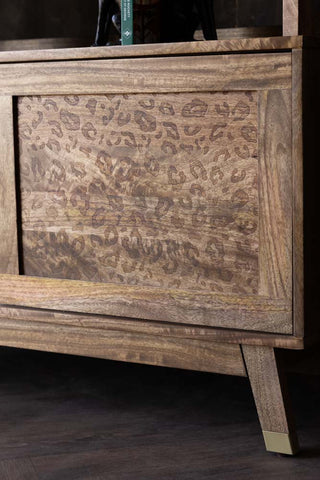 Close-up image of the Leopard Print Natural Wood Shelving Unit