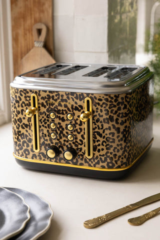 The Fabulous Leopard Print 4 Slice Toaster on a kitchen worktop with some kitchen accessories.