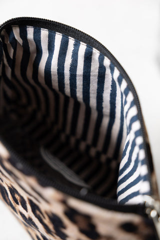 The stripe lining on the Leopard Print Velvet Makeup Bag.
