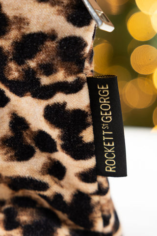 The Rockett St George label on the Leopard Print Velvet Makeup Bag. 
