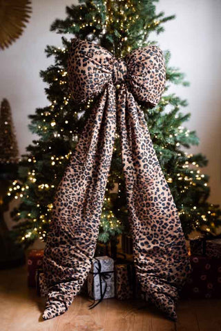 image of leopard print bow on the a Christmas tree. 