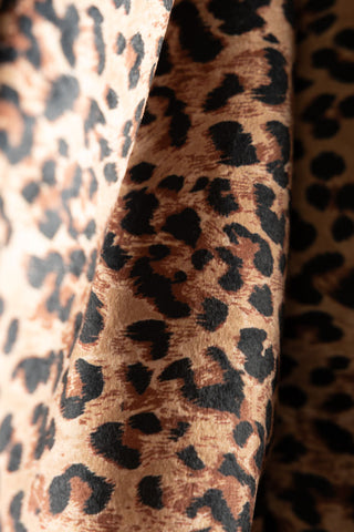 Close-up of the Leopard Print Velvet Oversized Bow Decoration.