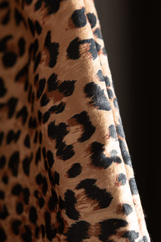 Close-up of the edge of the Leopard Print Velvet Oversized Bow Decoration.